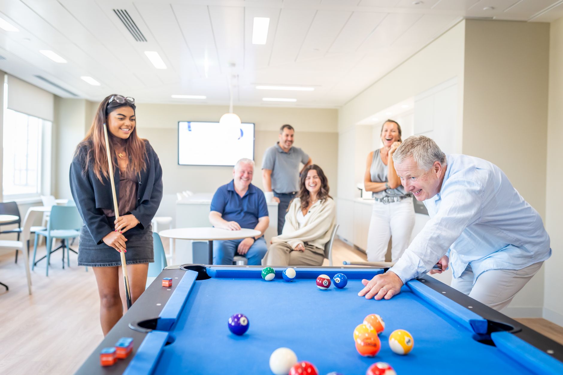 People gathering in a workplace lounge